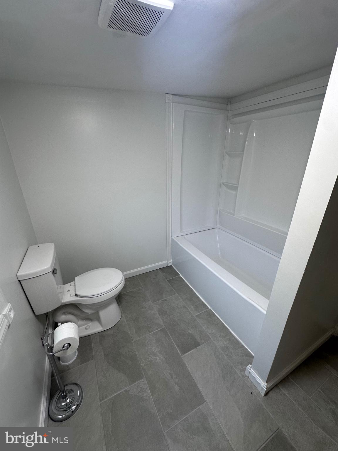 18712 Crossland Road Southwest Rawlings, MD 21557 - Photo 74 of 89 a white bath tub sitting next to a toilet