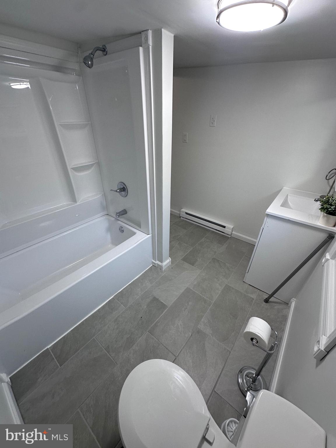 18712 Crossland Road Southwest Rawlings, MD 21557 - Photo 76 of 89 a bathroom with a granite countertop bathtub sink vanity mirror and toilet
