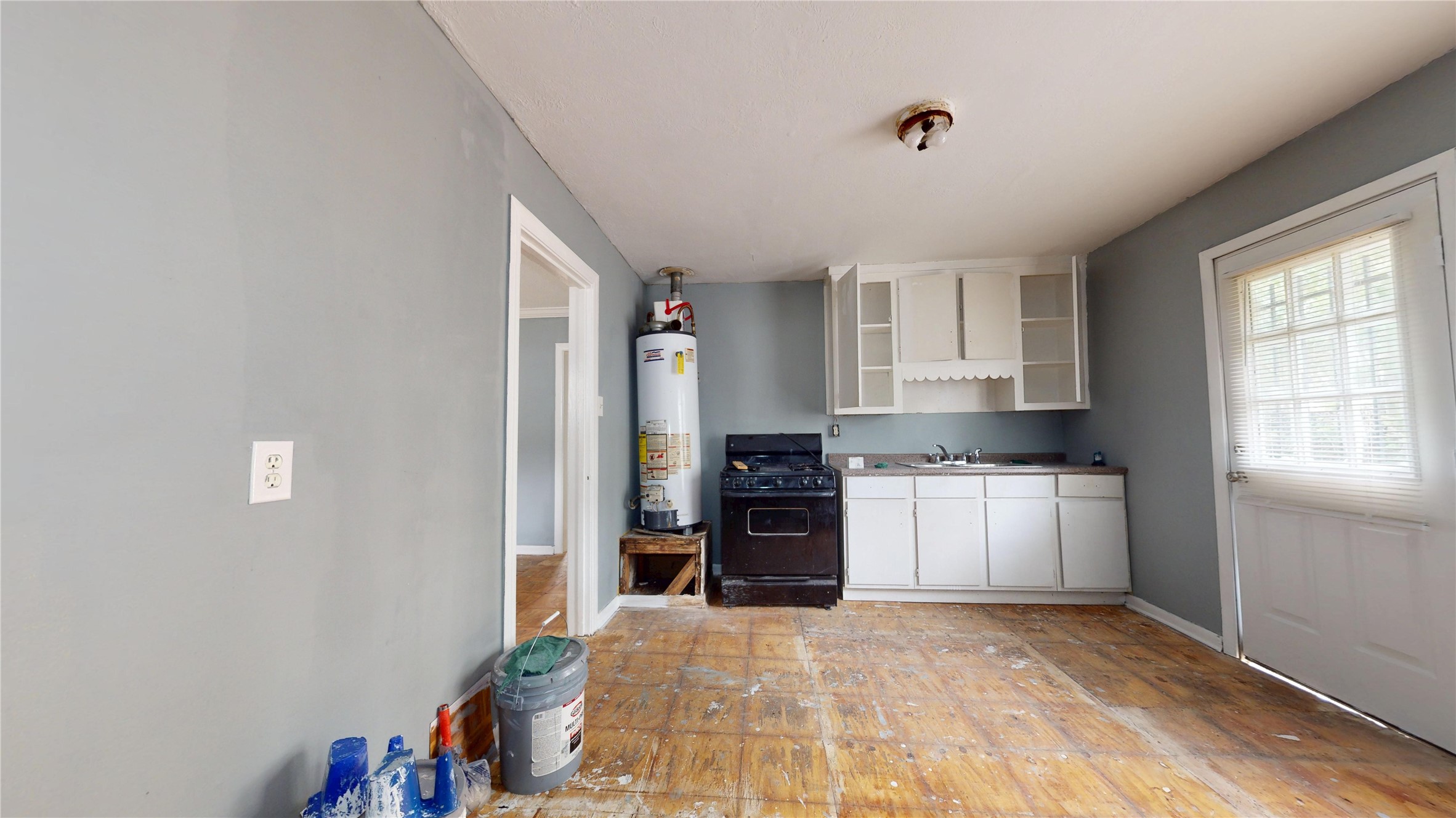 6604 Conley Street Houston, TX 77021 - Photo 14 of 28 a kitchen with a refrigerator and a stove