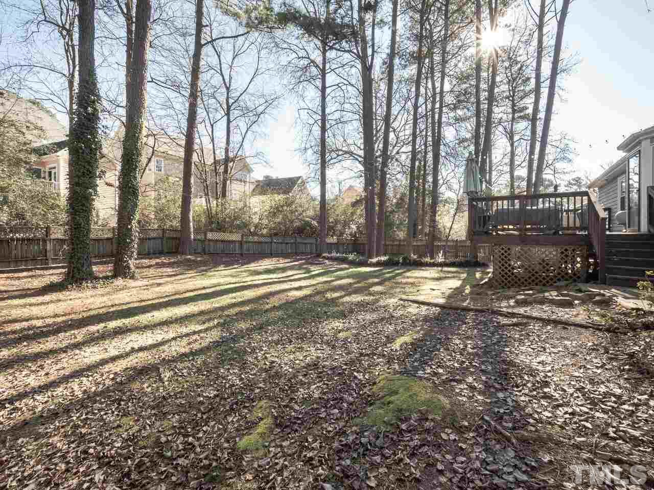 6920 Chamonix Place Raleigh, NC 27613 - Photo 22 of 28 a view of street with large trees