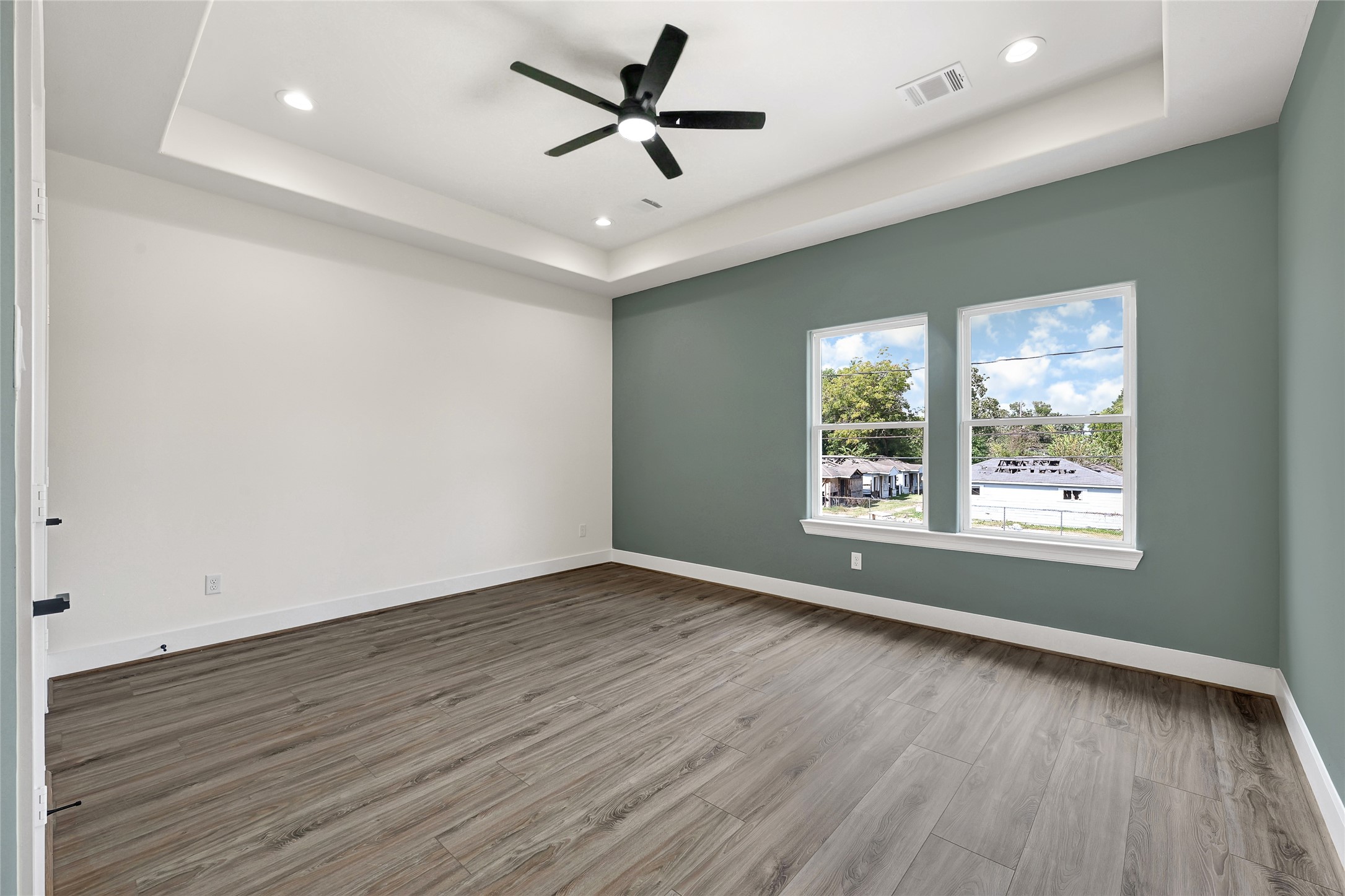 3834 Mt Pleasant Street Houston, TX 77021 - Photo 44 of 50 a view of empty room with wooden floor and fan