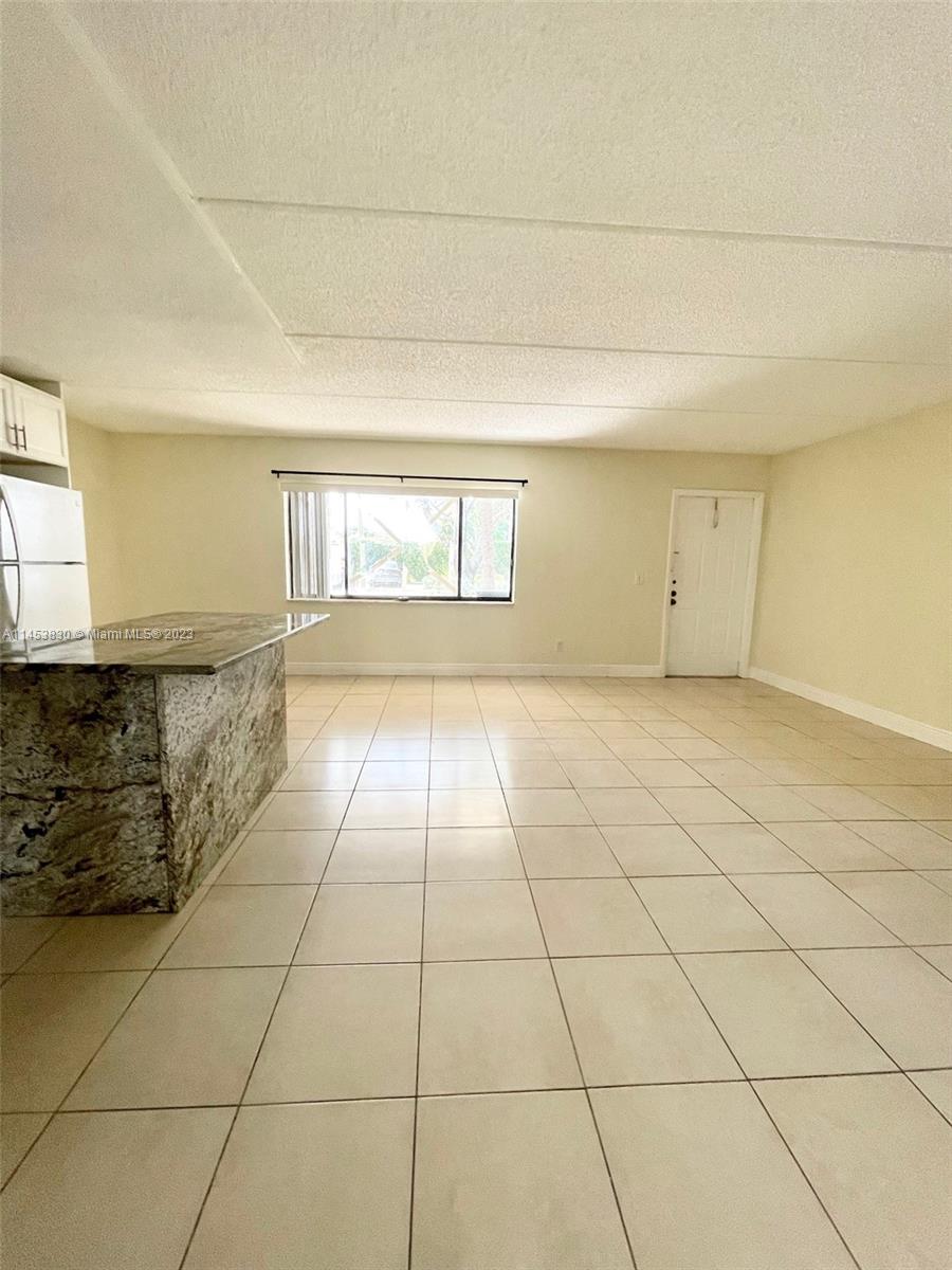 105 Meadows Circle, Unit 105 Boynton Beach, FL 33436 - Photo 11 of 18 a view of an empty room and window