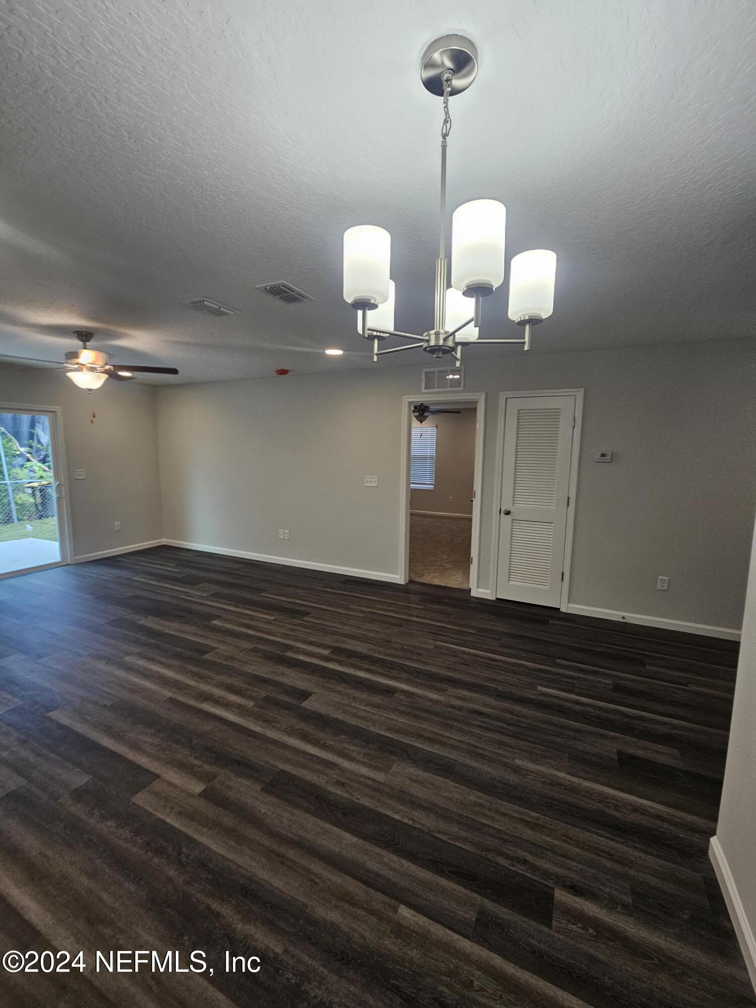 7607 Del Road Jacksonville, FL 32244 - Photo 4 of 15 a view of a room with wooden floor