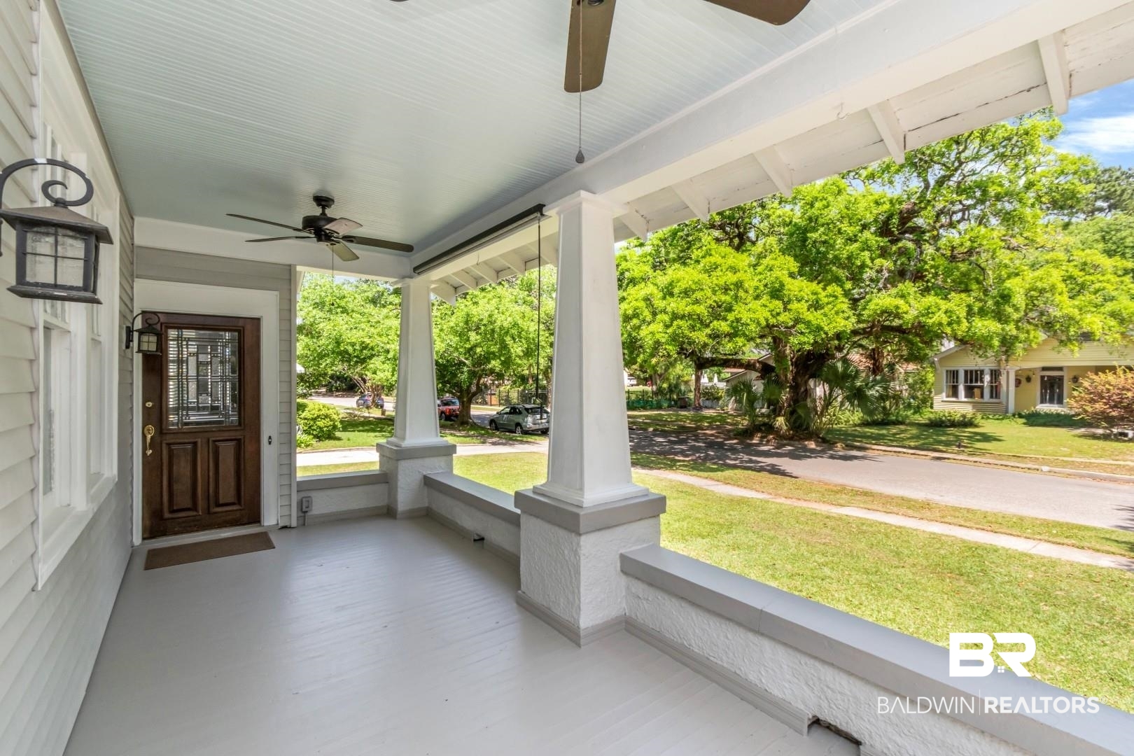10 Macy Place Mobile, AL 36604 - Photo 30 of 43 Porch featuring a ceiling fan and a lawn