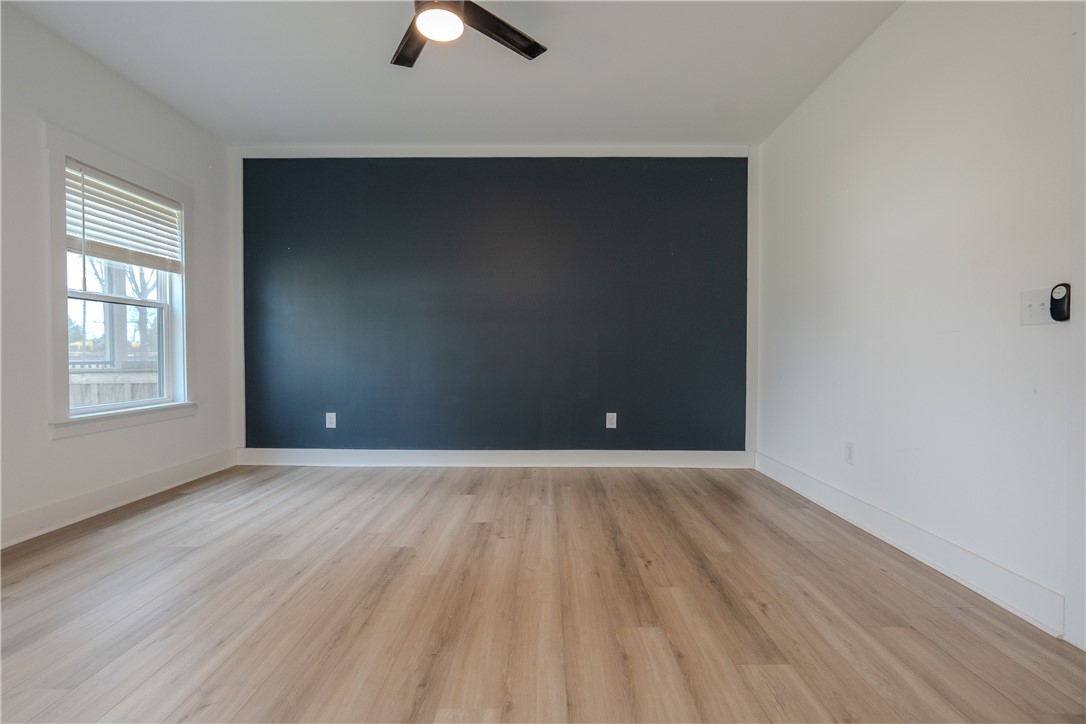 203 Mr Jim's Lane Clinton, SC 29325 - Photo 14 of 28 This airy room offers light wood flooring and a refreshing neutral palette, creating an inviting atmosphere.