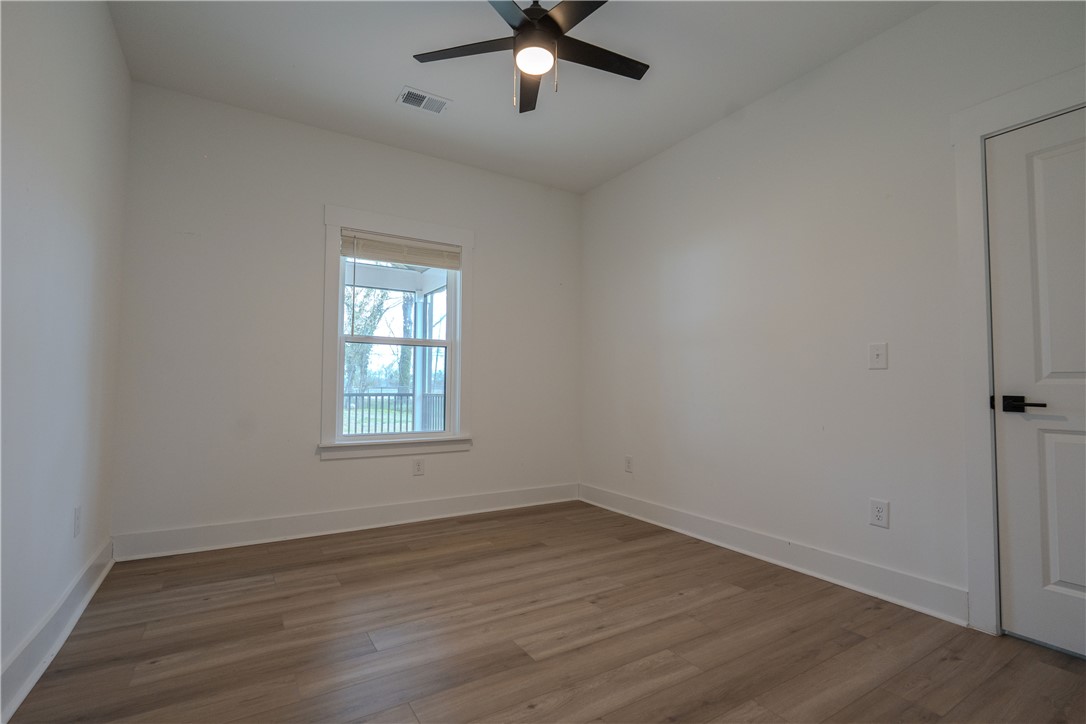 203 Mr Jim's Lane Clinton, SC 29325 - Photo 16 of 28 This bright room features a window overlooking a porch, offering comfort and style.