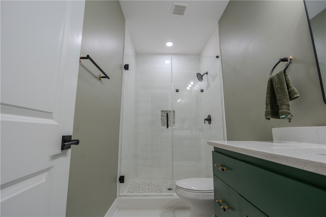203 Mr Jim's Lane Clinton, SC 29325 - Photo 18 of 28 This bathroom features a contemporary shower and modern vanity with clean lines.