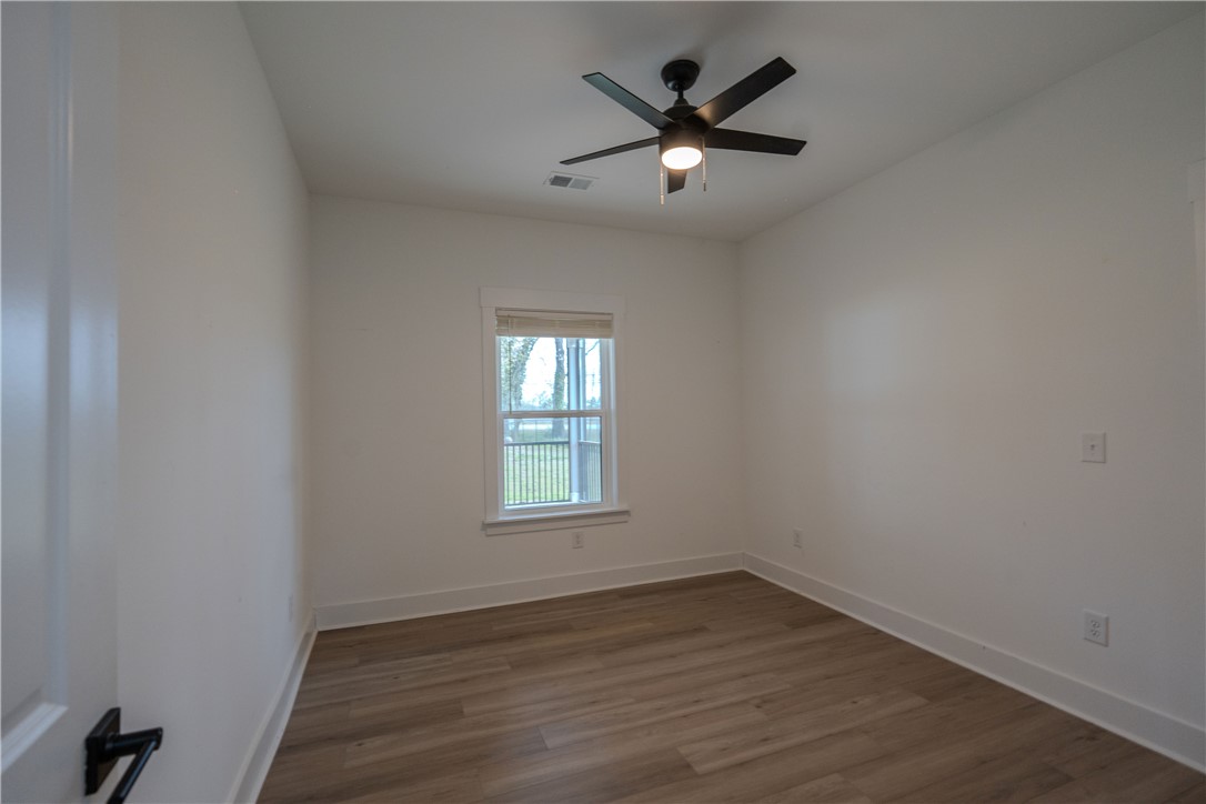 203 Mr Jim's Lane Clinton, SC 29325 - Photo 20 of 28 This bright room features durable flooring and a refreshing ceiling fan.