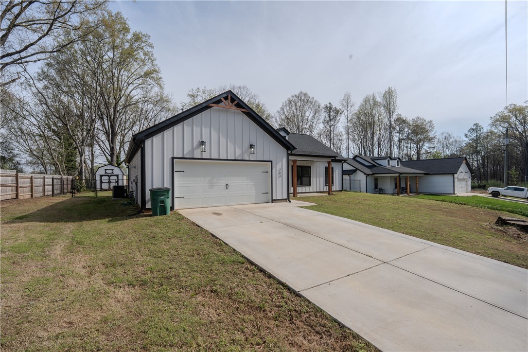 203 Mr Jim's Lane Clinton, SC 29325 - Photo 2 of 28 This newly constructed residence offers a contemporary design with a spacious driveway and attached garage.