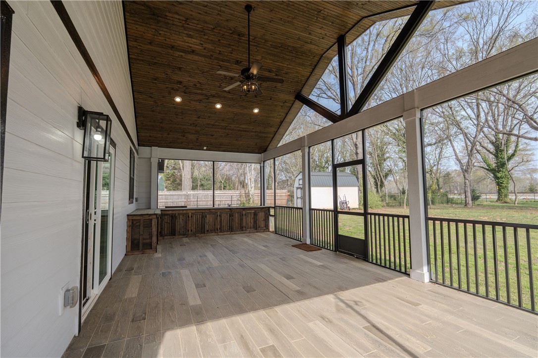 203 Mr Jim's Lane Clinton, SC 29325 - Photo 22 of 28 This airy screened porch features an inviting space for relaxation and enjoyment.