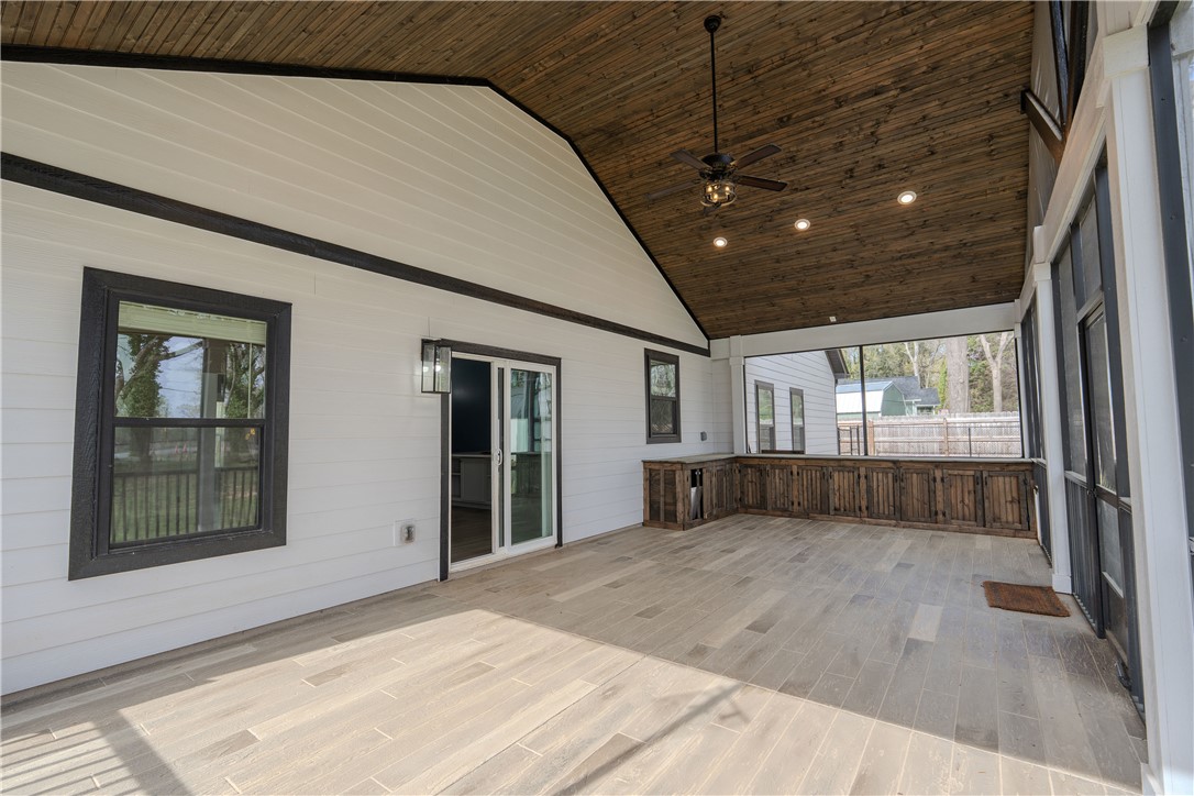 203 Mr Jim's Lane Clinton, SC 29325 - Photo 23 of 28 This spacious patio offers an inviting outdoor retreat with elegant wood accents and ample room for relaxation.