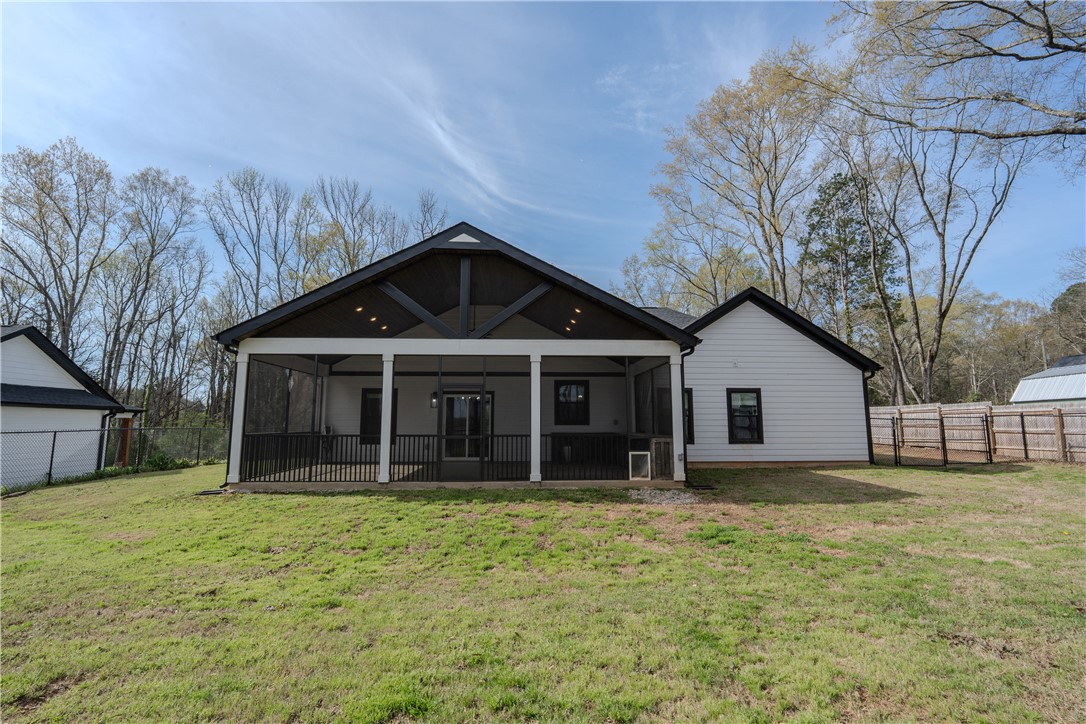 203 Mr Jim's Lane Clinton, SC 29325 - Photo 24 of 28 This residence features a charming screened-in porch with a gabled roof, perfect for outdoor enjoyment.