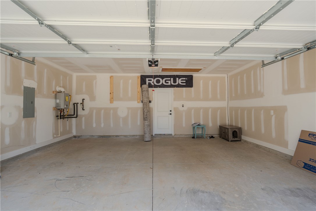 203 Mr Jim's Lane Clinton, SC 29325 - Photo 28 of 28 This spacious garage offers ample room for parking and additional storage solutions.
