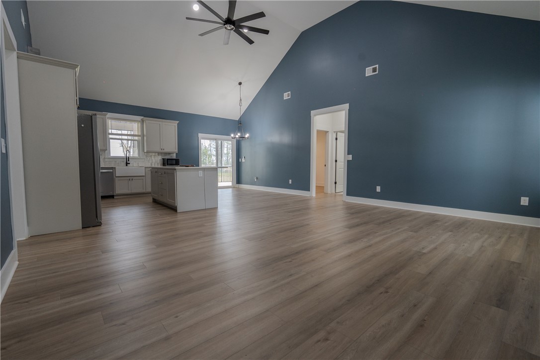 203 Mr Jim's Lane Clinton, SC 29325 - Photo 4 of 28 This expansive great room offers an open-concept layout with vaulted ceilings and durable flooring.