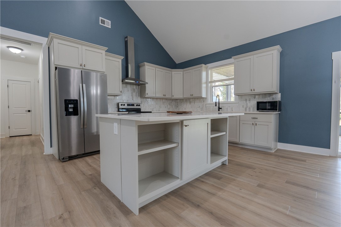 203 Mr Jim's Lane Clinton, SC 29325 - Photo 7 of 28 This luminous kitchen features modern appliances and an inviting atmosphere.