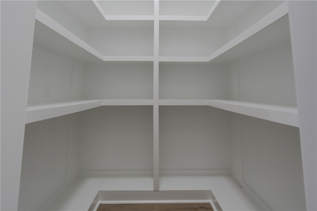 203 Mr Jim's Lane Clinton, SC 29325 - Photo 8 of 28 This spacious pantry provides ample storage with built-in shelving and easy-to-clean flooring.