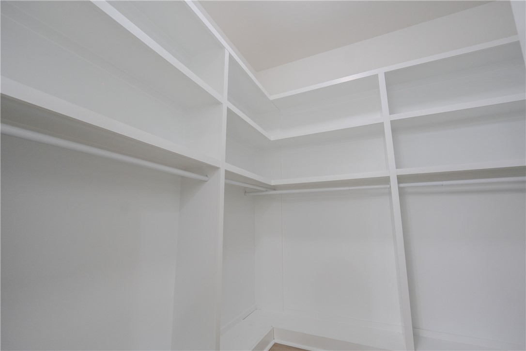 203 Mr Jim's Lane Clinton, SC 29325 - Photo 9 of 28 Ample storage solutions elevate the organization of this meticulously designed closet.