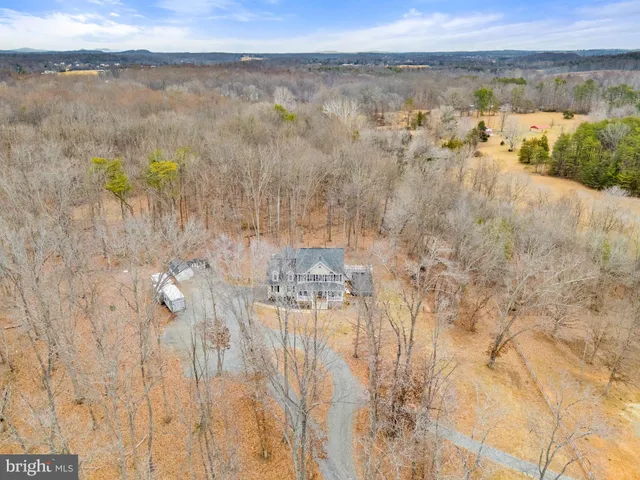 a kitchen with a refrigerator stove and wooden cabinets