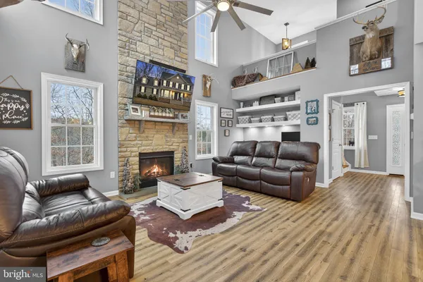 a bathroom with a toilet and a shower curtain