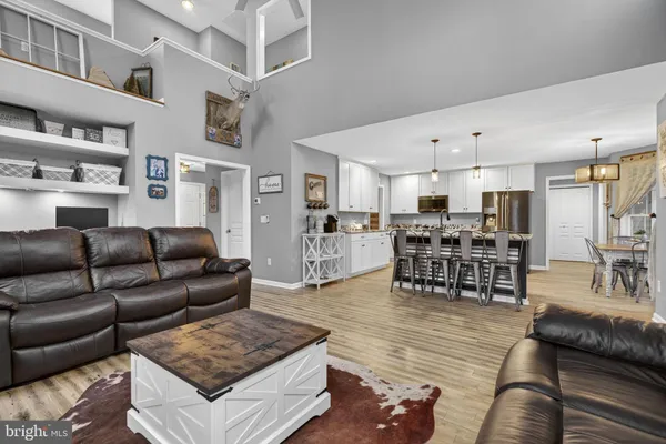 a bedroom that has a bed and a chandelier