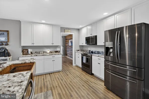 a view of a livingroom with workspace and a window