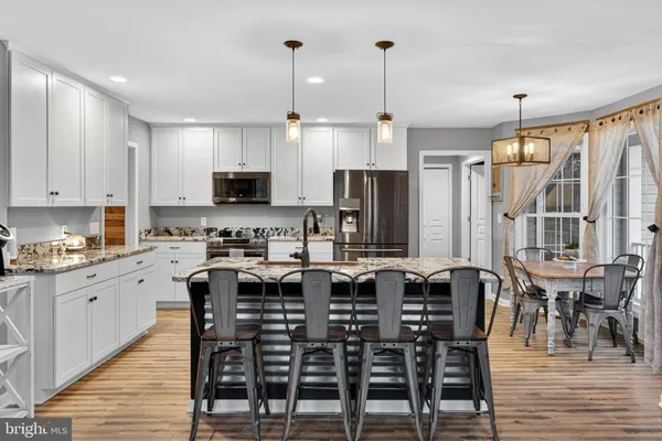 a view of a livingroom with workspace and a couch