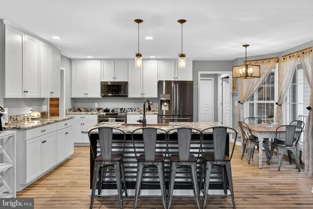 a view of a livingroom with workspace and a couch