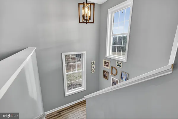 a view of walk in closet with clothes