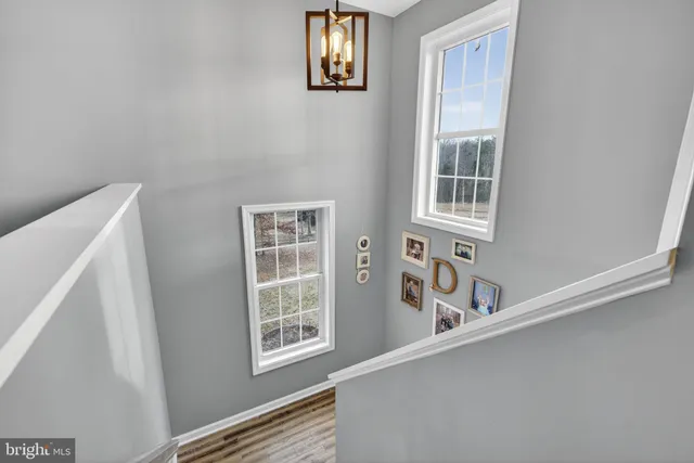 a view of walk in closet with clothes