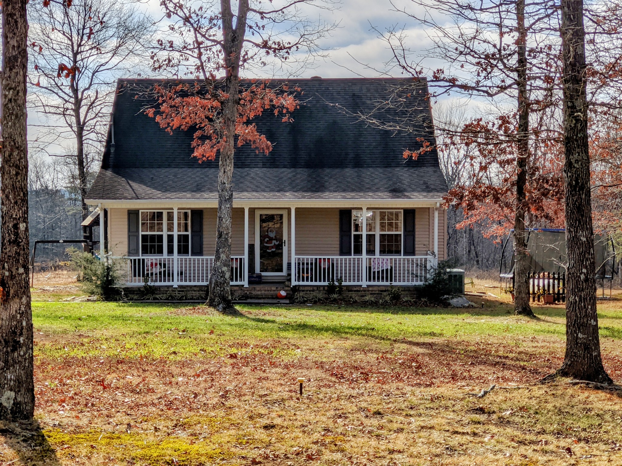 642 Meyers Road Altamont, TN 37301 - Photo 2 of 33 a view of a house with a big yard and large trees