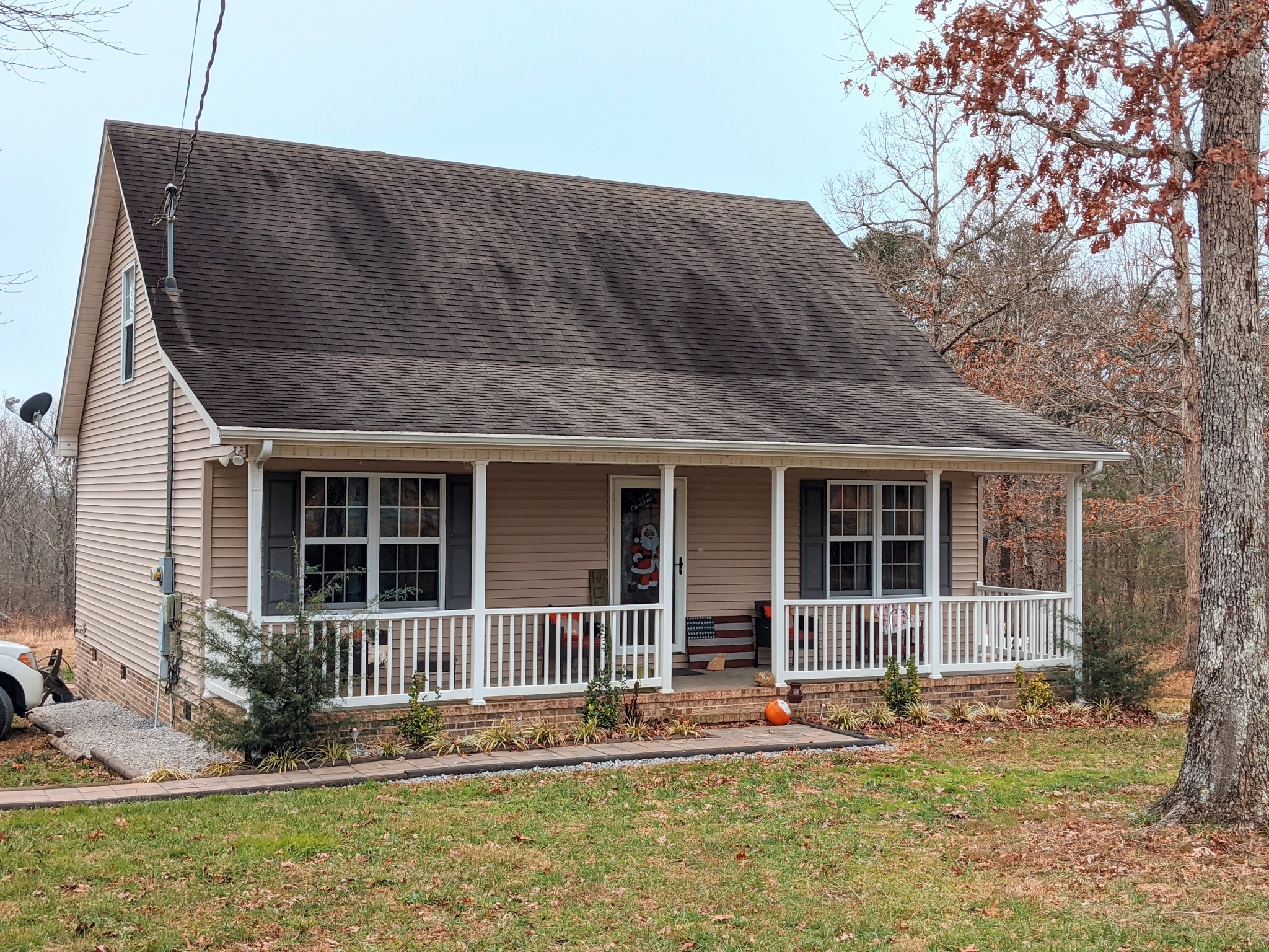642 Meyers Road Altamont, TN 37301 - Photo 23 of 33 a backyard of a house with lots of green space and glass windows