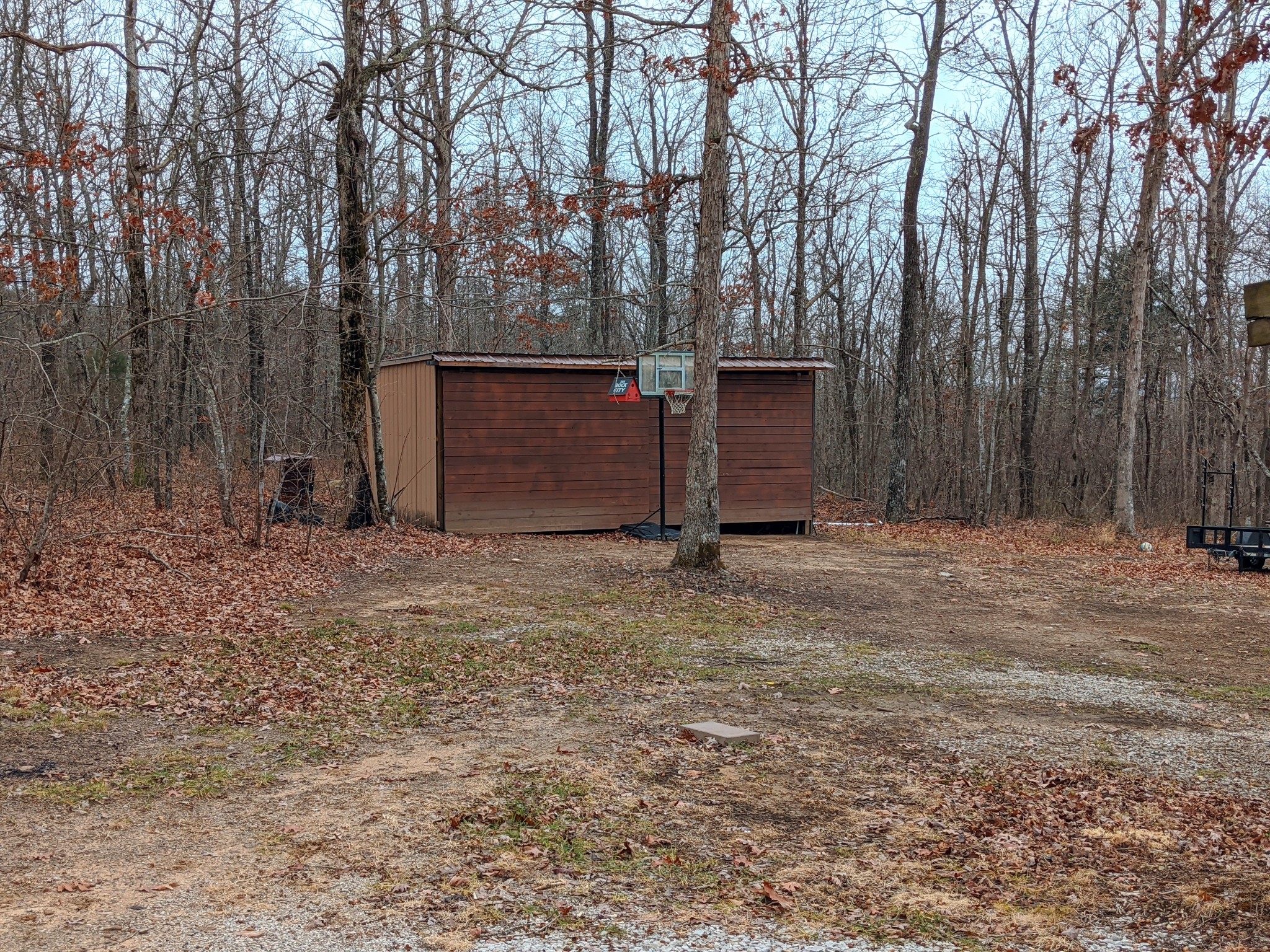 642 Meyers Road Altamont, TN 37301 - Photo 24 of 33 a backyard of a house with large trees and wooden fence