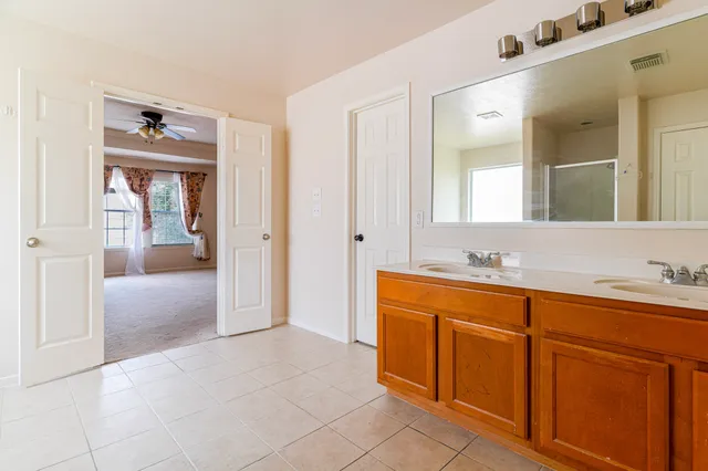 a white toilet sitting next to a small white tub