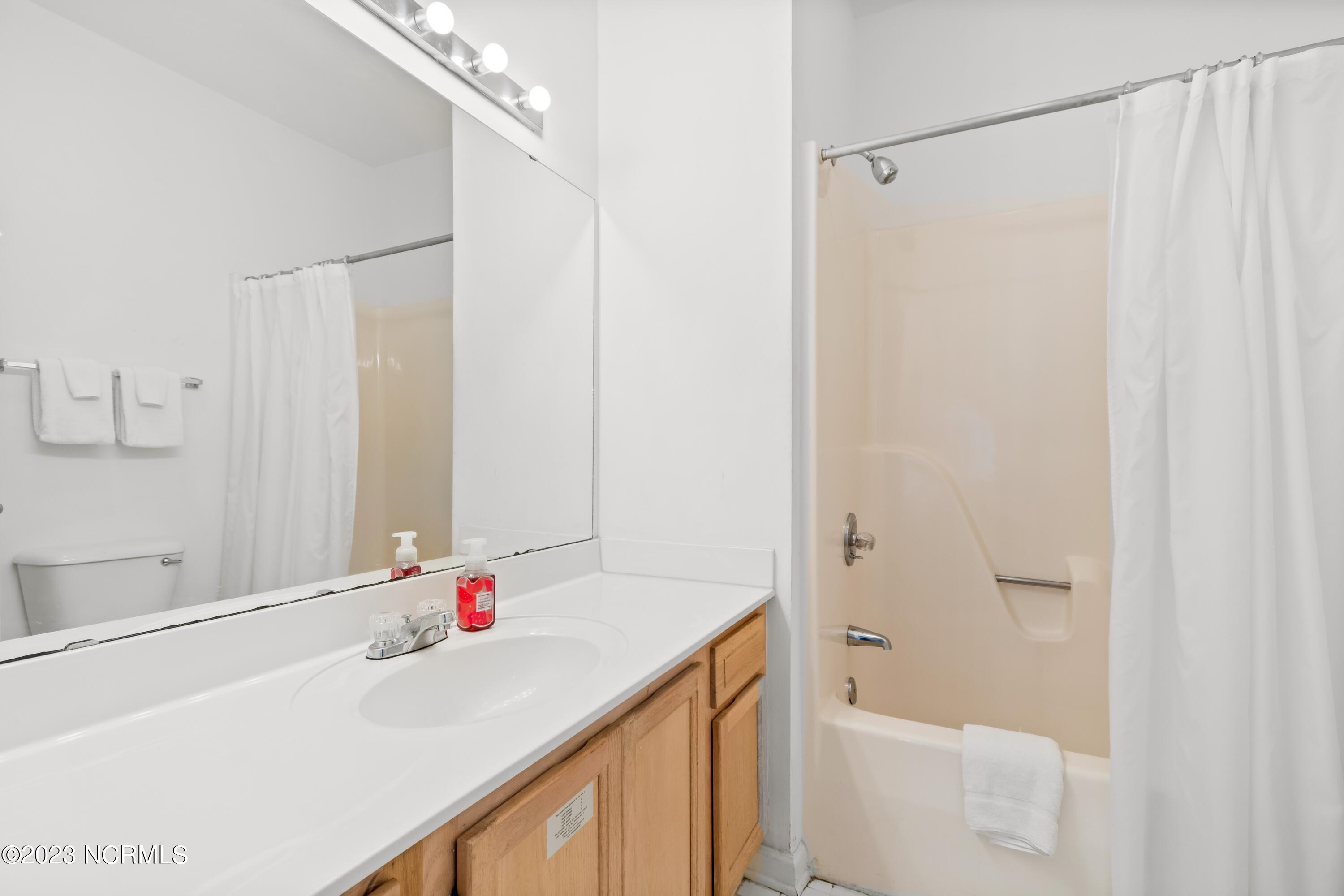 226 Clubhouse Road, Unit 17D Sunset Beach, NC 28468 - Photo 7 of 37 This spacious bathroom has plenty of storage and counter space.