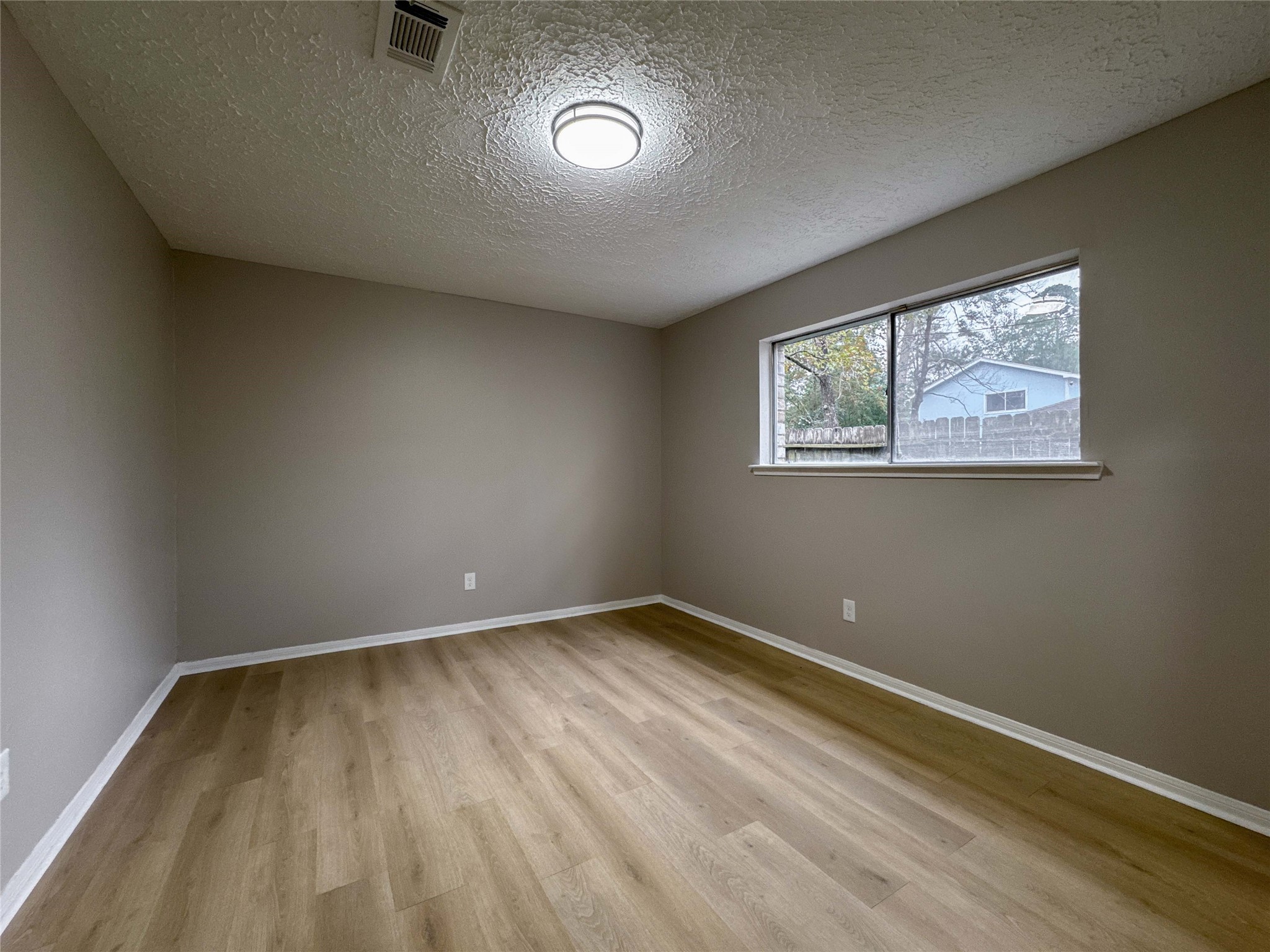 22822 Canyon Lake Drive Spring, TX 77373 - Photo 14 of 26 an empty room with a bench