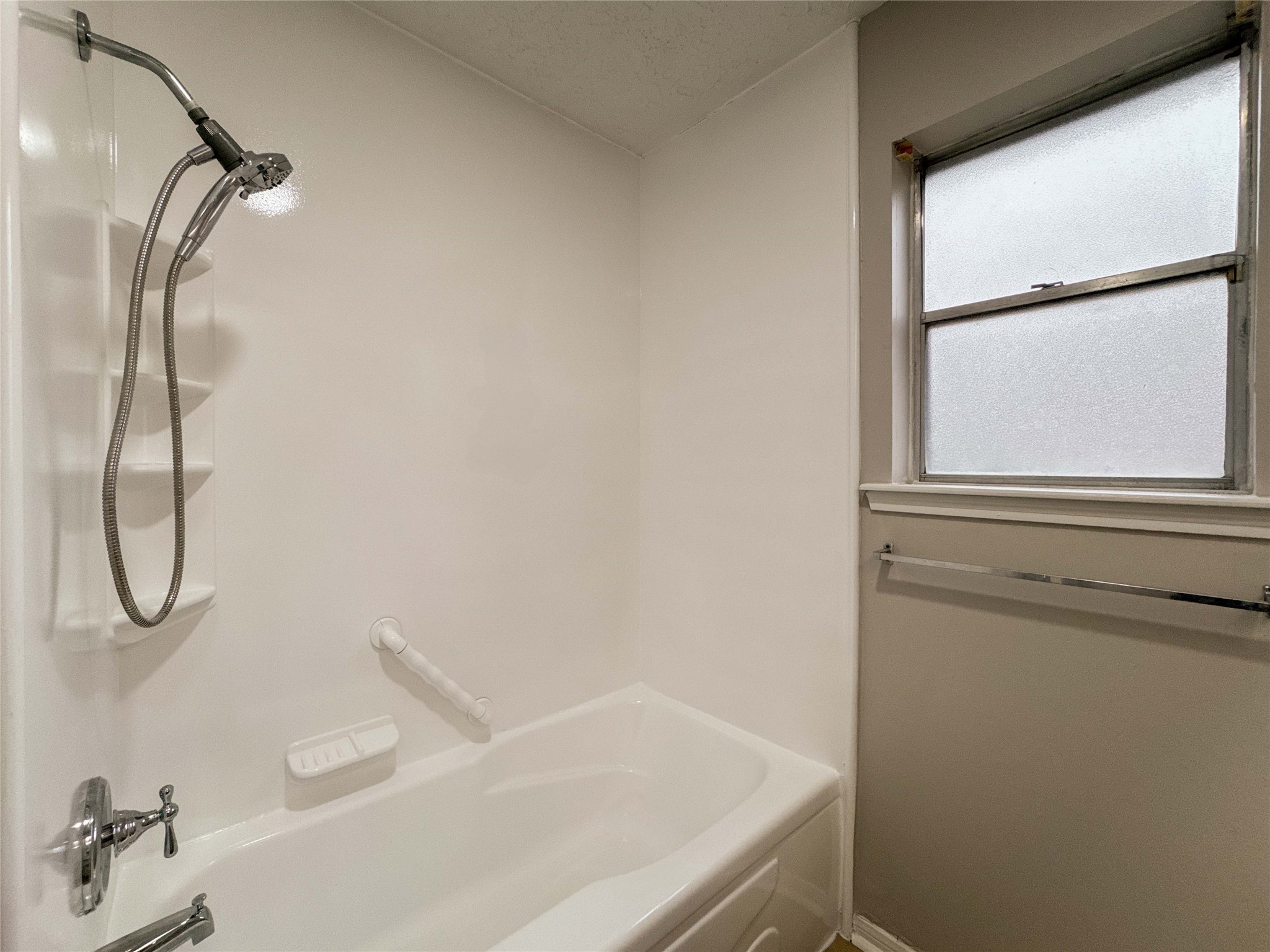 22822 Canyon Lake Drive Spring, TX 77373 - Photo 16 of 26 a bathroom with a bath tub with a shower