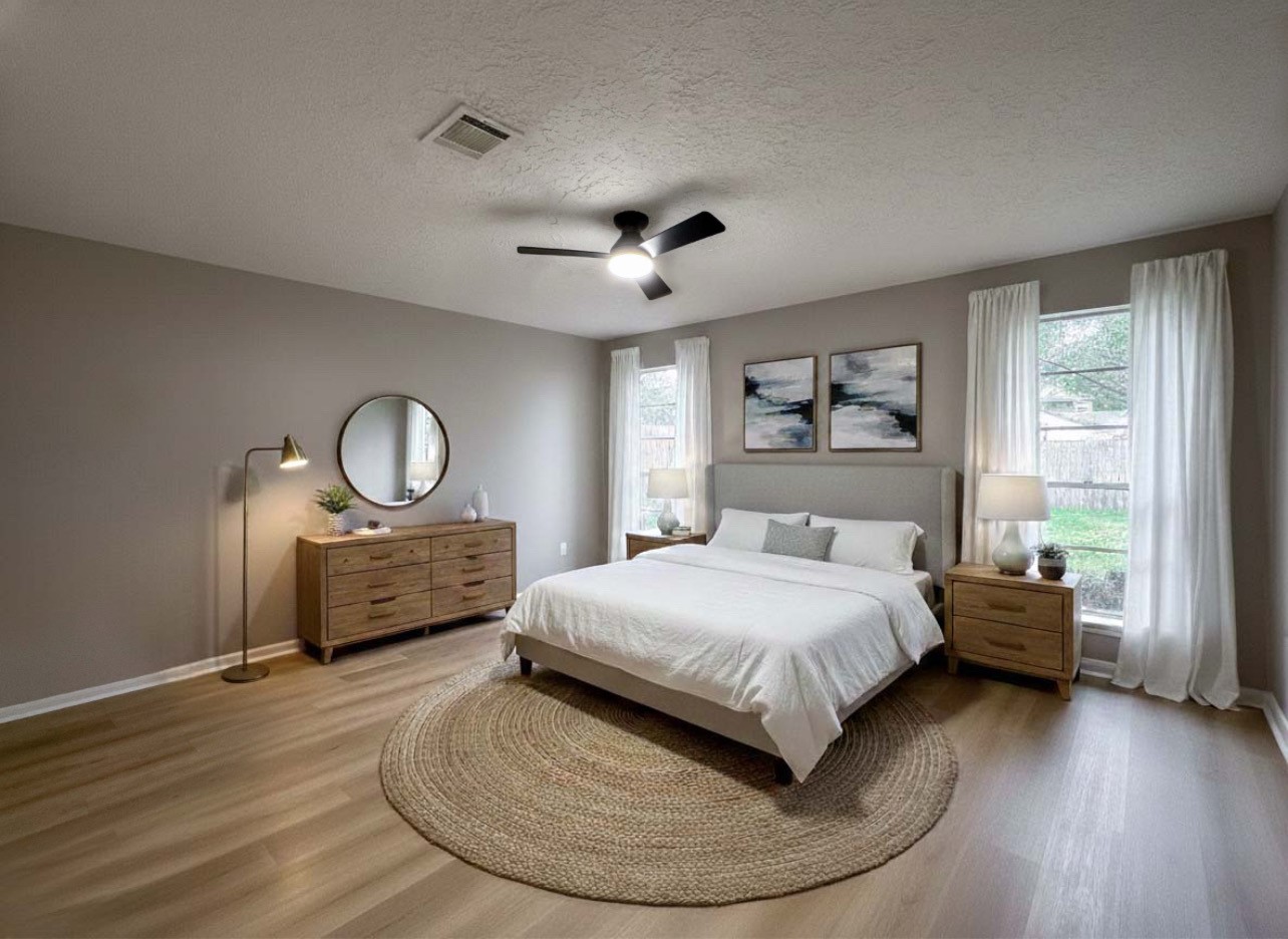 22822 Canyon Lake Drive Spring, TX 77373 - Photo 18 of 26 a bedroom with a bed and wooden floor