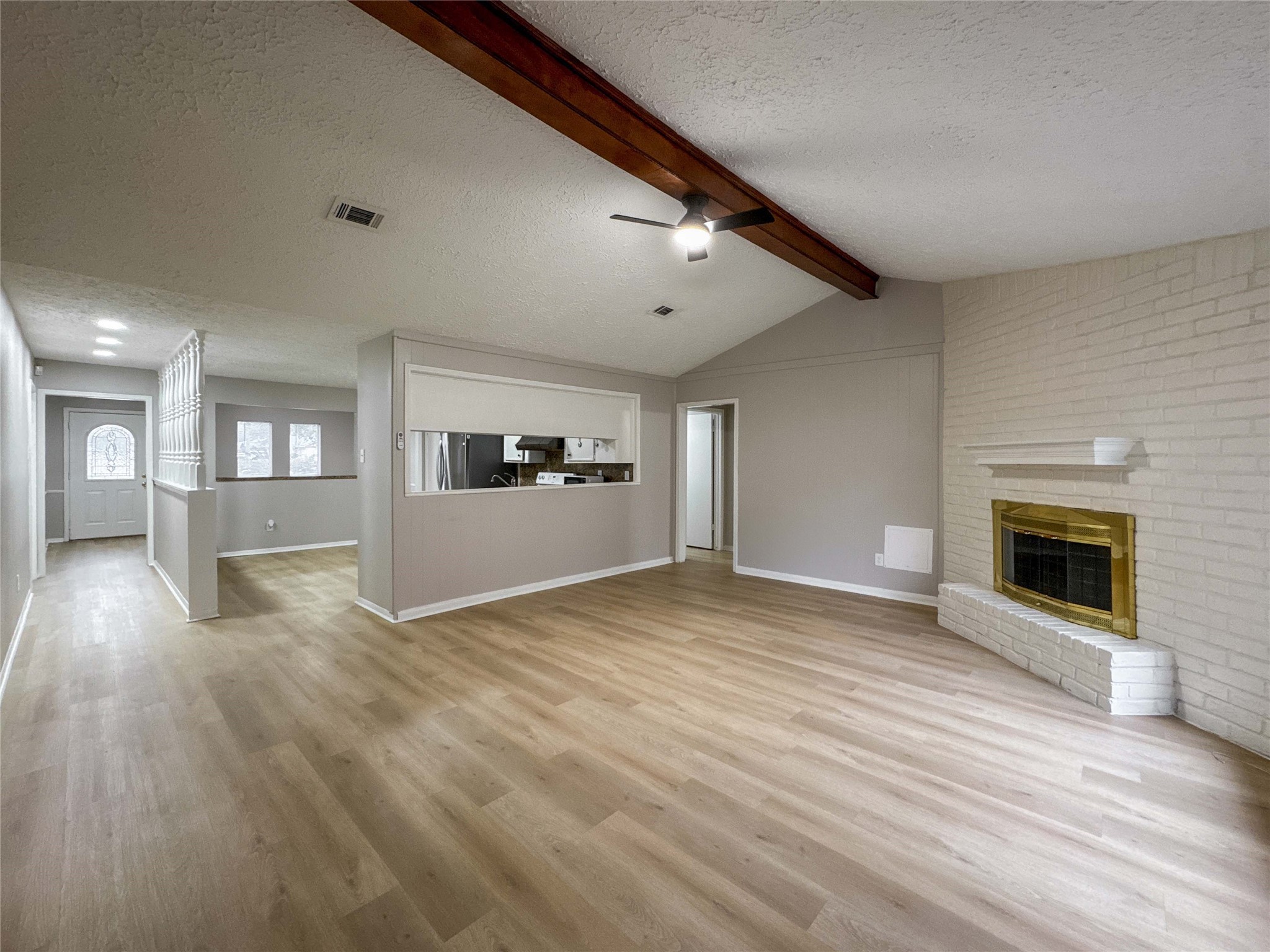 22822 Canyon Lake Drive Spring, TX 77373 - Photo 2 of 26 a view of a kitchen with a sink oven cabinets and a living room