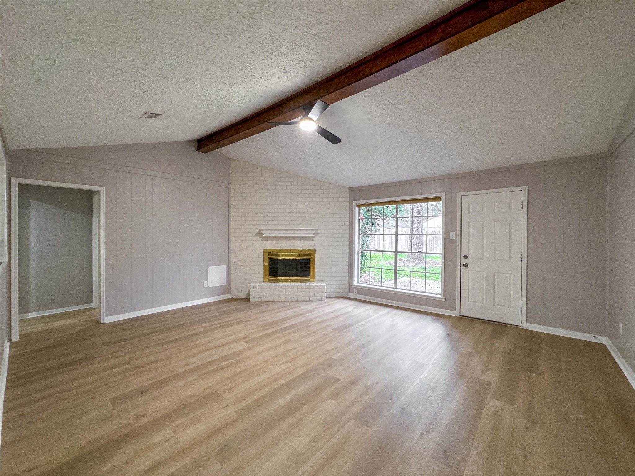 22822 Canyon Lake Drive Spring, TX 77373 - Photo 4 of 26 a view of an empty room with wooden floor and a window