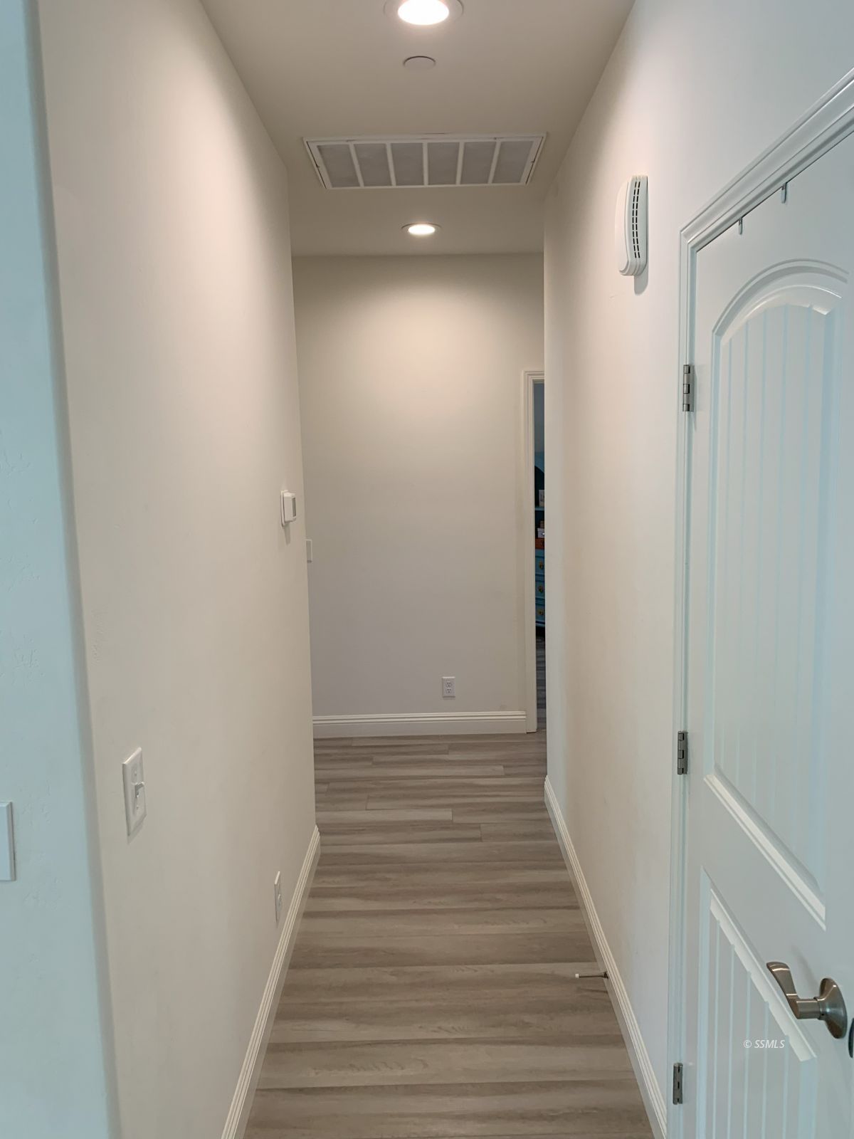 419 Thomas Street Ridgecrest, CA 93555 - Photo 15 of 32 a view of a hallway with wooden floor and entryway