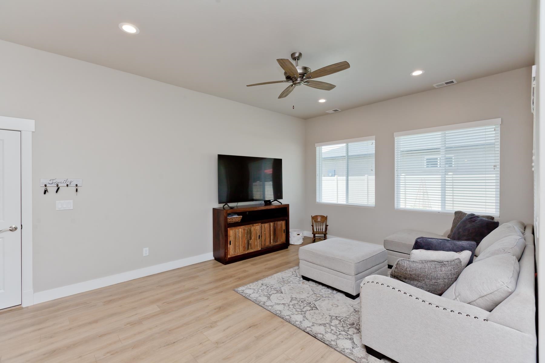 628 Thunder Ridge Drive Grand Junction, CO 81504 - Photo 13 of 37 a living room with furniture and a flat screen tv