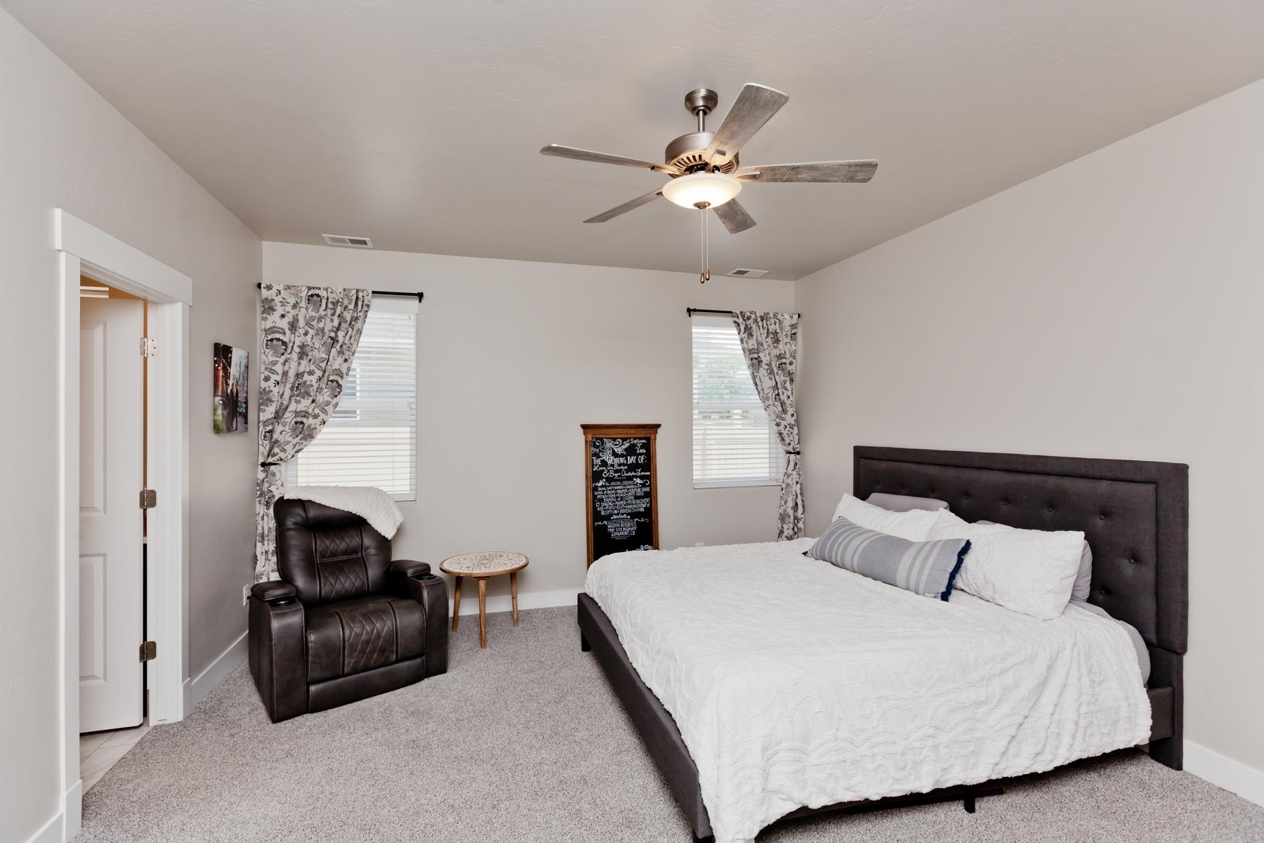 628 Thunder Ridge Drive Grand Junction, CO 81504 - Photo 16 of 37 a bedroom with a bed and window