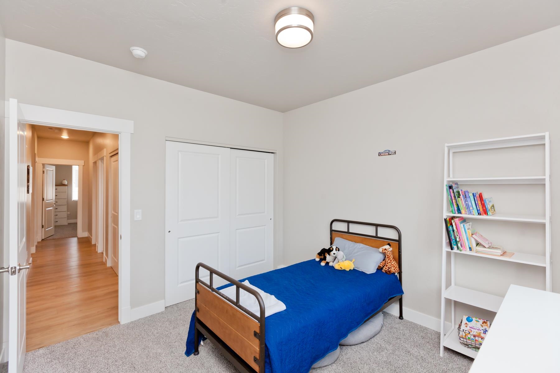 628 Thunder Ridge Drive Grand Junction, CO 81504 - Photo 17 of 37 a bedroom with a bed and wooden floor