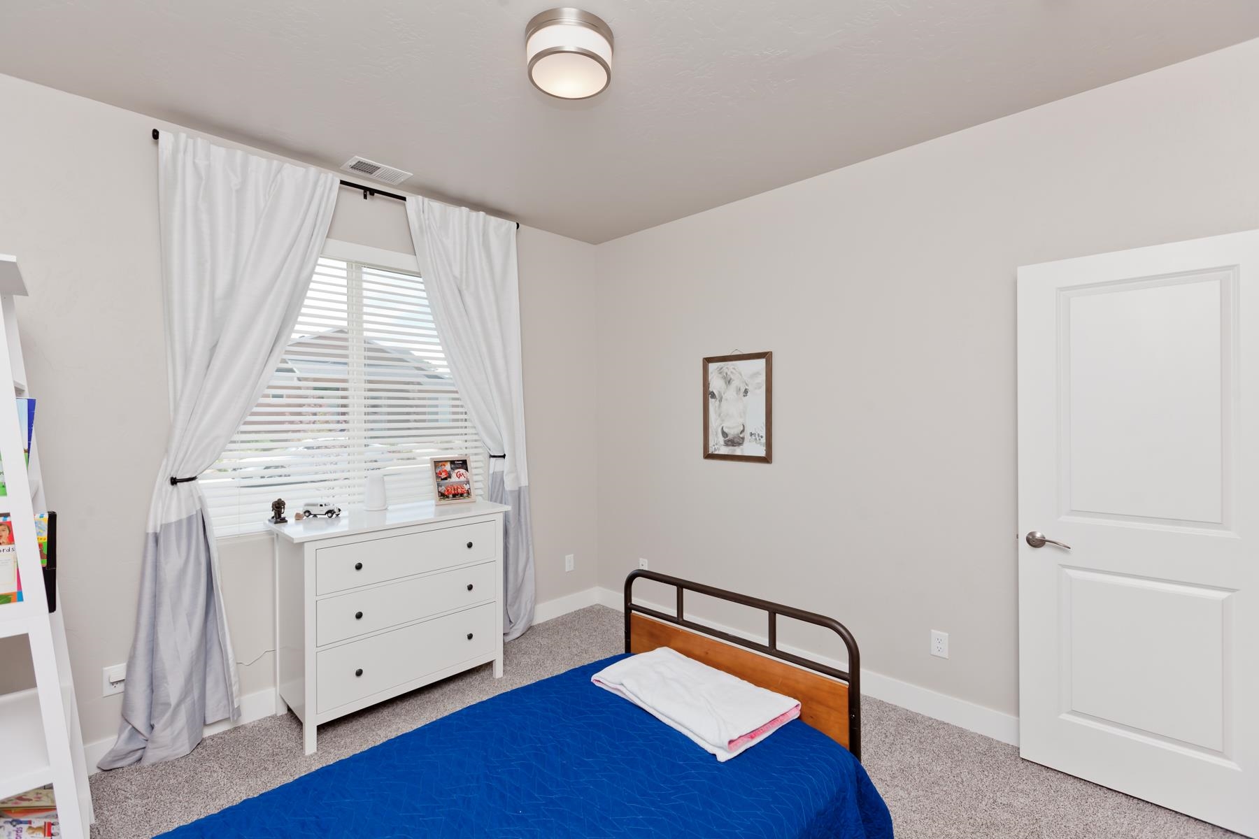 628 Thunder Ridge Drive Grand Junction, CO 81504 - Photo 18 of 37 a view of an empty room with wooden floor