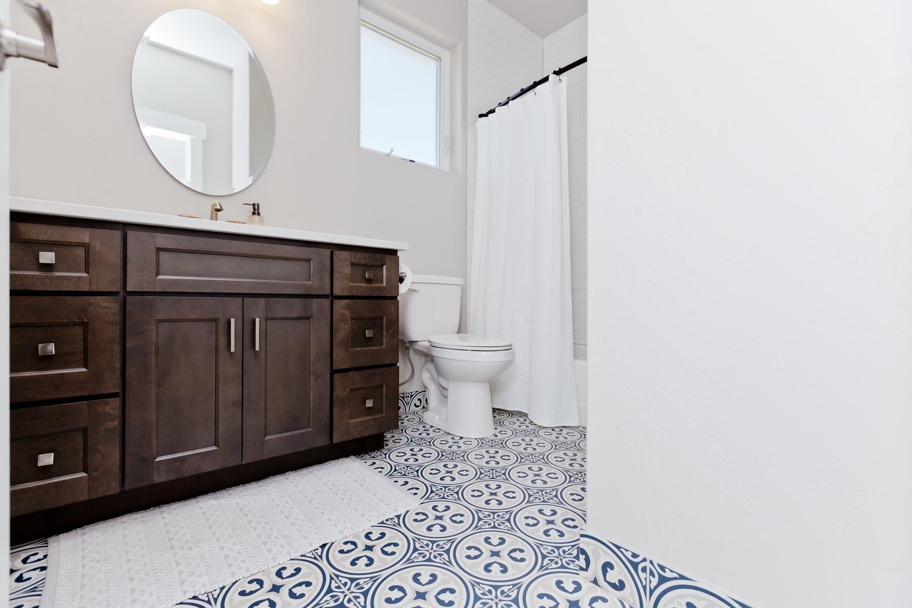 628 Thunder Ridge Drive Grand Junction, CO 81504 - Photo 19 of 37 a bathroom with a sink a mirror and a toilet
