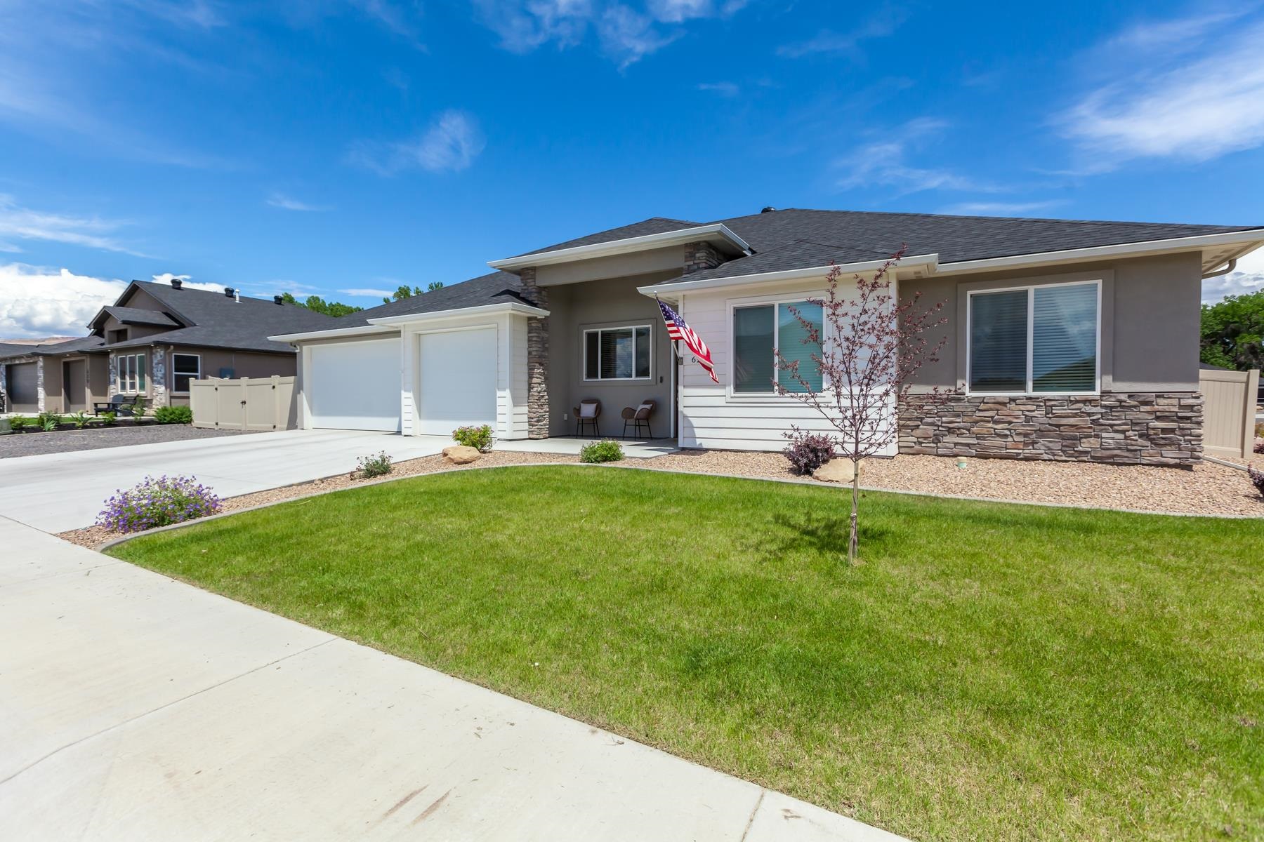 628 Thunder Ridge Drive Grand Junction, CO 81504 - Photo 2 of 37 a view of a house with backyard and porch