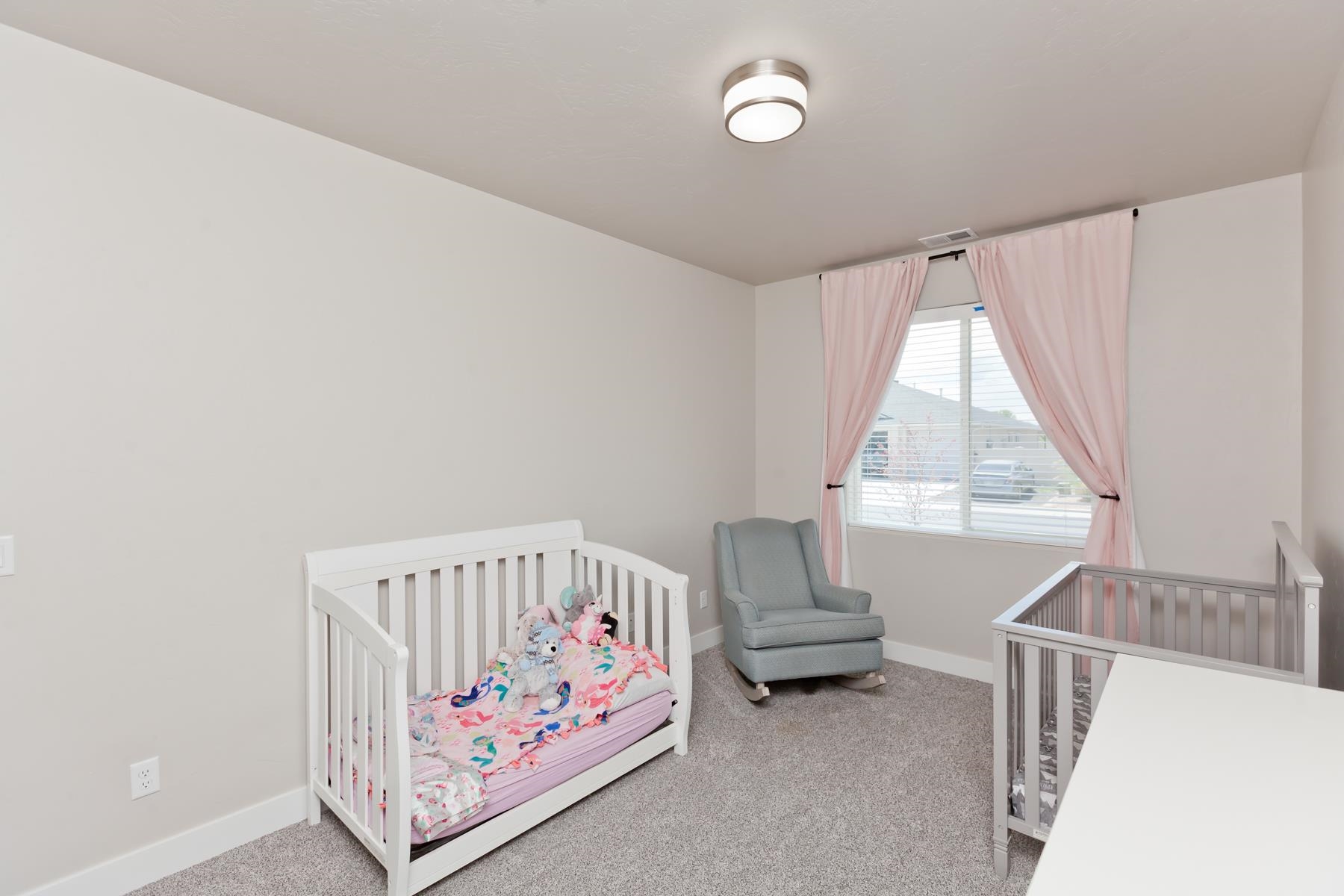 628 Thunder Ridge Drive Grand Junction, CO 81504 - Photo 25 of 37 a bedroom with furniture and a window