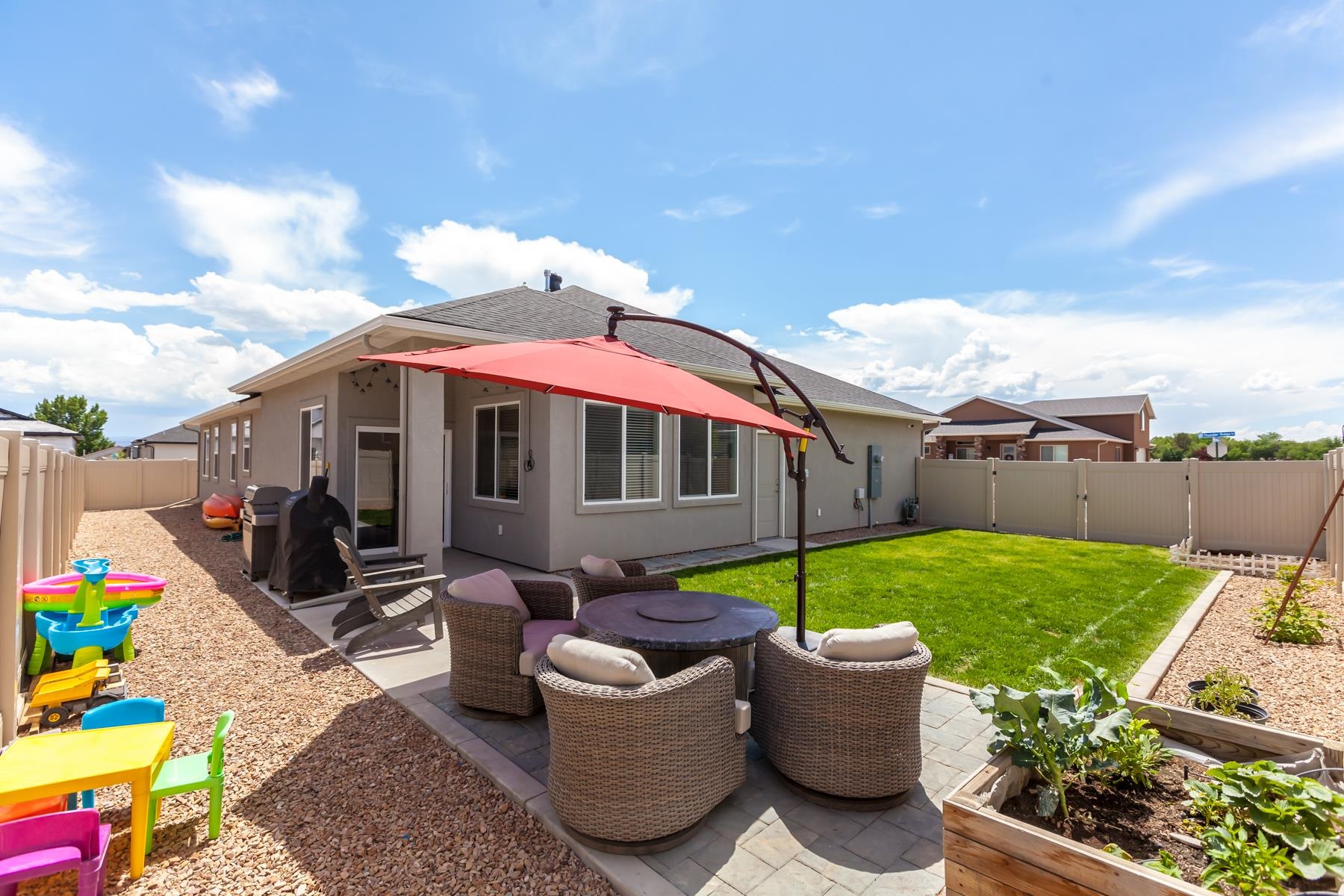 628 Thunder Ridge Drive Grand Junction, CO 81504 - Photo 34 of 37 a view of a chair and table in backyard