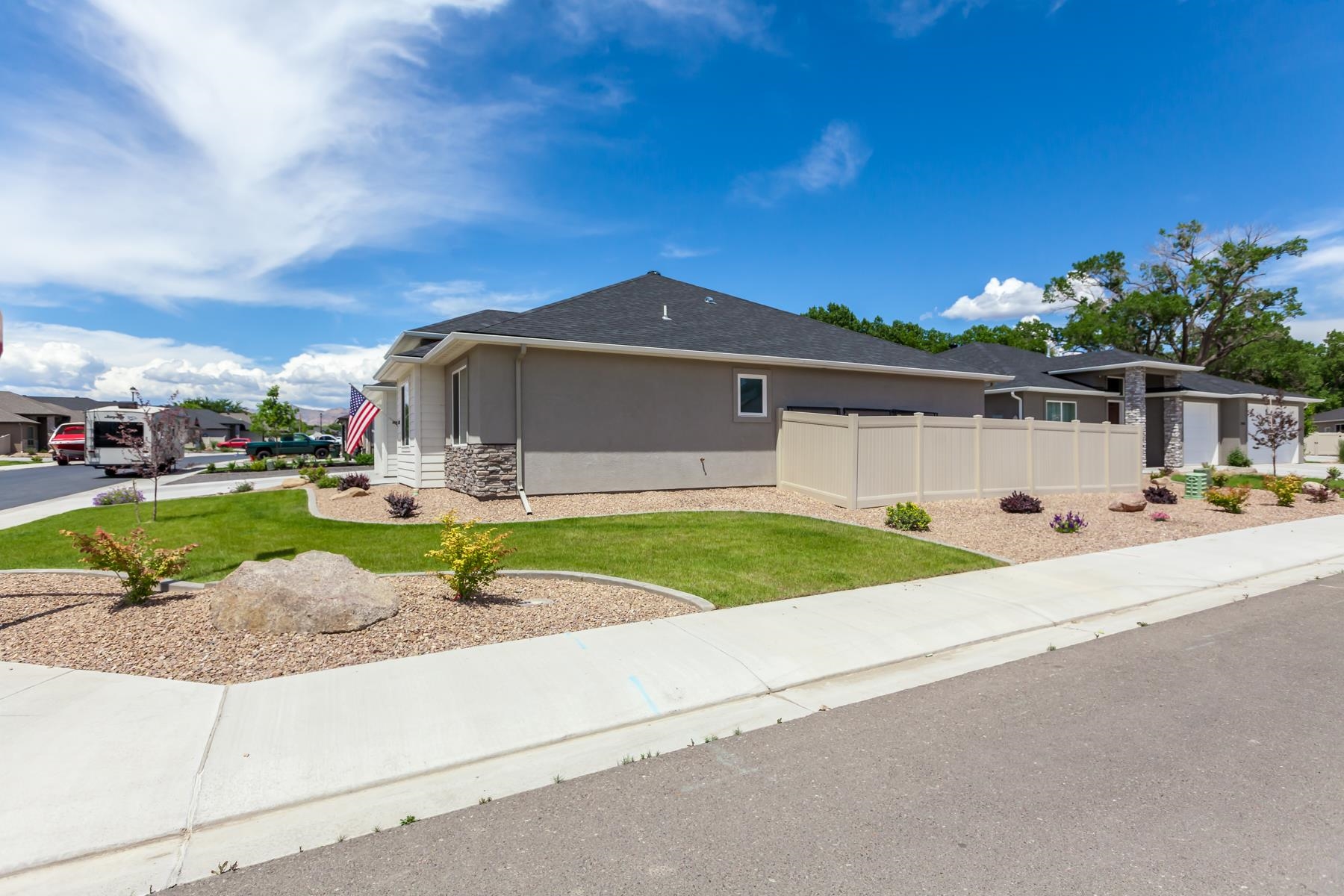 628 Thunder Ridge Drive Grand Junction, CO 81504 - Photo 37 of 37 a front view of a house with a yard and potted plants
