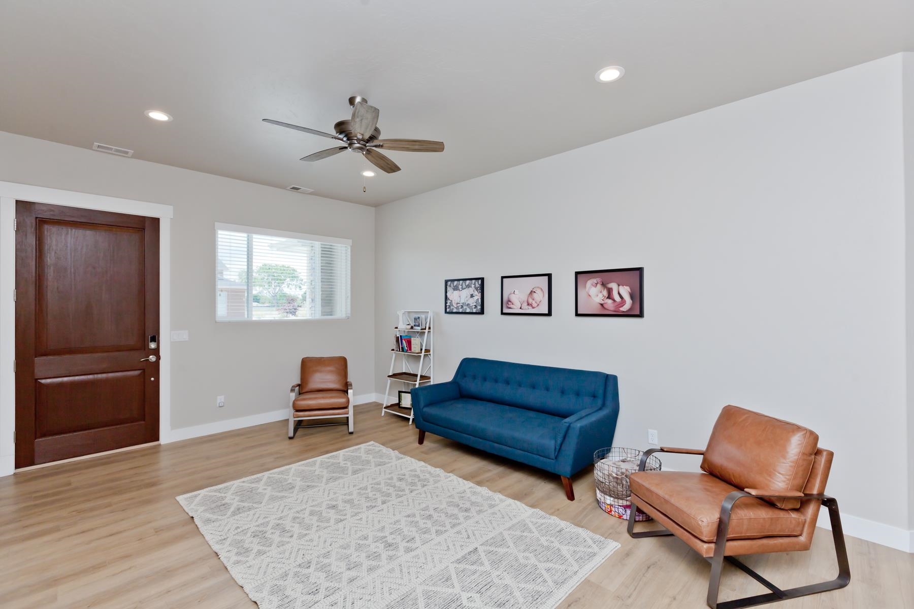 628 Thunder Ridge Drive Grand Junction, CO 81504 - Photo 5 of 37 a living room with furniture and a rug
